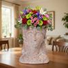 Ceramic head with colorful flower arrangement