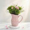Tulips and chrysanthemums in a ceramic jug