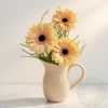 Gerberas in a ceramic jug