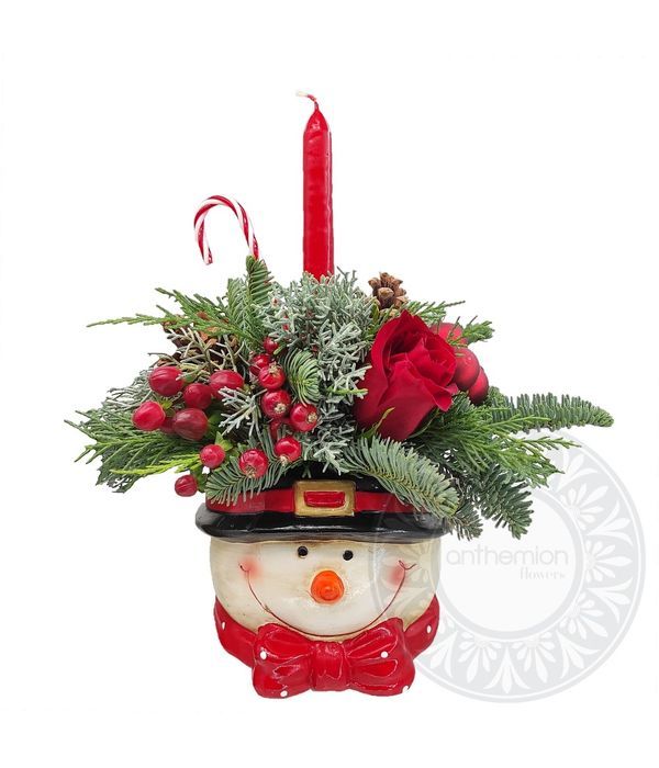 Christmas arrangement in ceramic snowman with candle