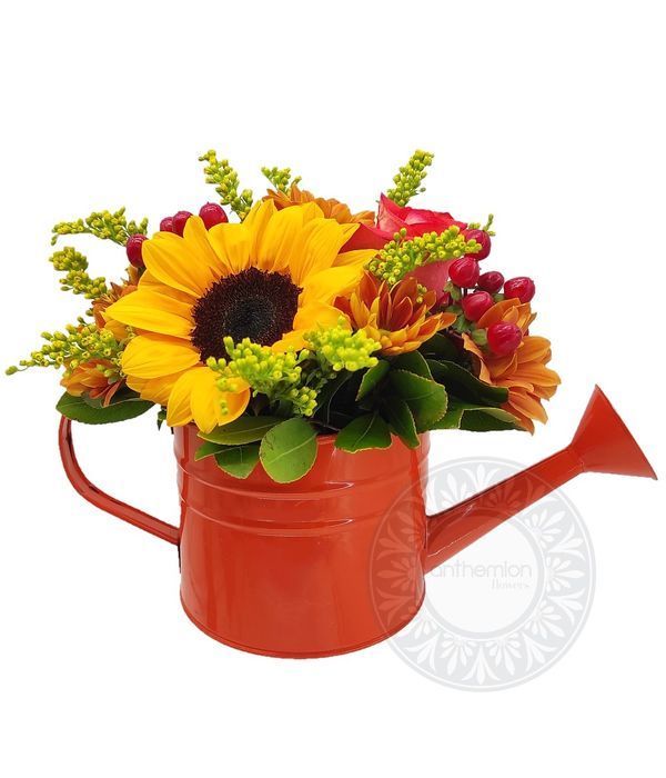 Charming watering can with flowers