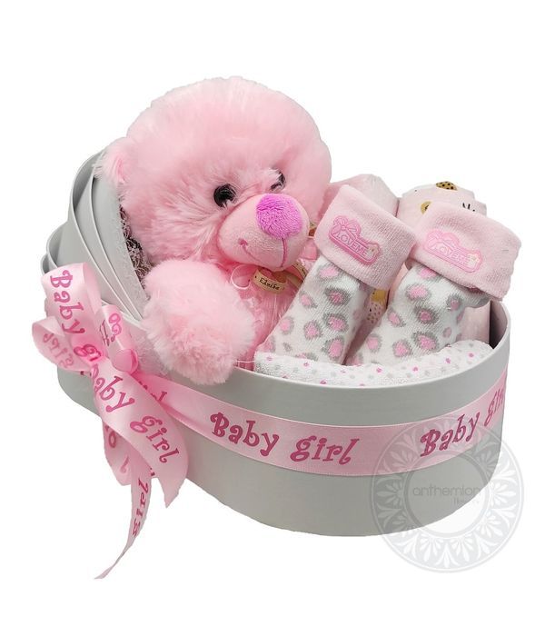 Baby bed with gifts for a newborn baby girl