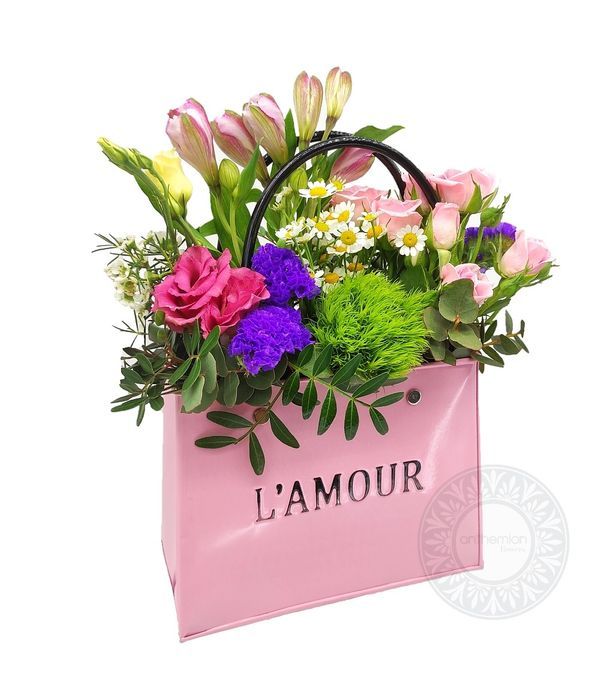 Ροζ μεταλλική τσάντα με χαρούμενα λουλούδια