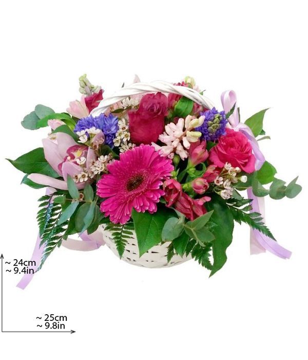 Basket with lilac and fuchsia flowers