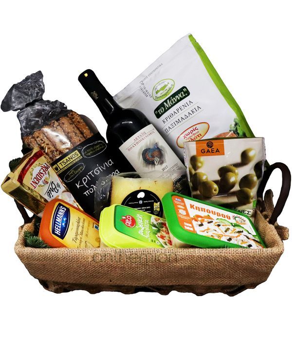 Variety of goodies and a bottle of wine in basket 