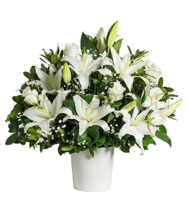 White flower arrangement in ceramic pot
