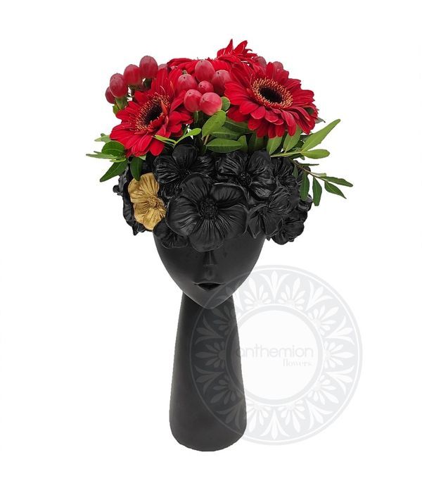 Black ceramic head with red flowers
