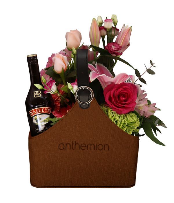 Brown Leather Newspaper case with a Baileys and Flowers
