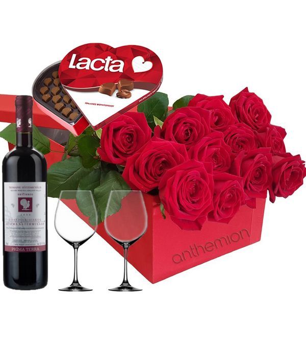 Red roses in a box with chocolates, wine and 2 glasses