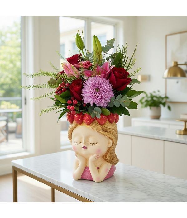 Ceramic head with strawberries and flower arrangement