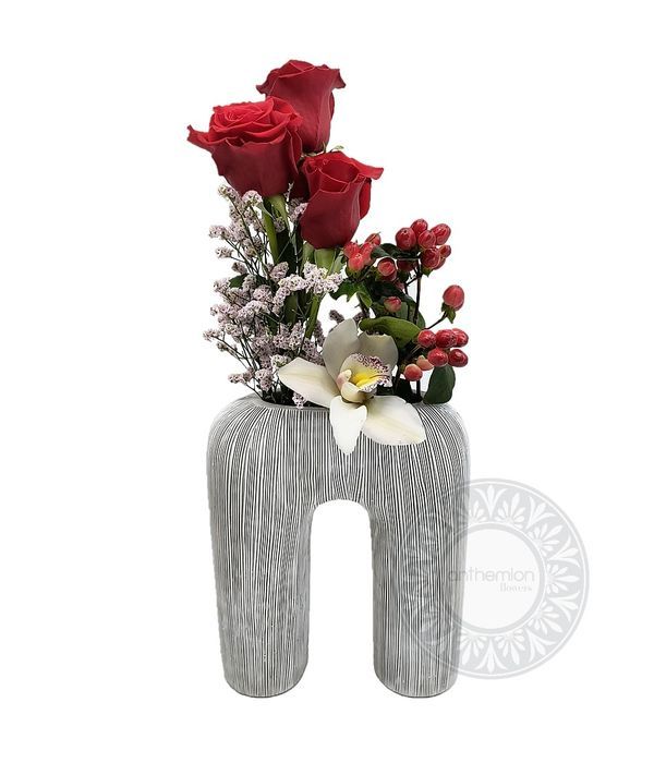 Embossed polyresin vase with flower composition