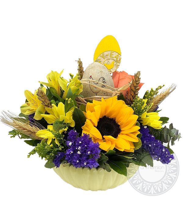 Easter yellow flowers in a ceramic bowl