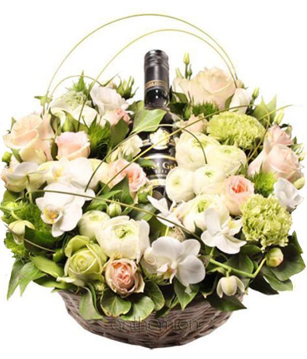 Basket with white flowers and wine