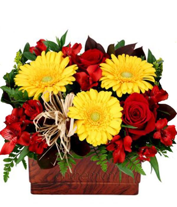 Arrangement with yellow and red flowers