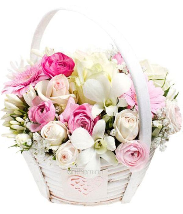 Pink and white flowers in basket