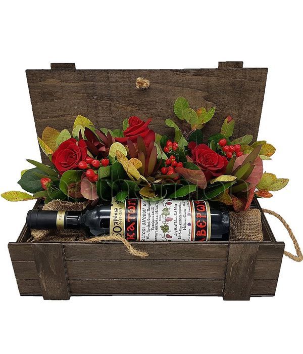 Wine and flowers in wooden box
