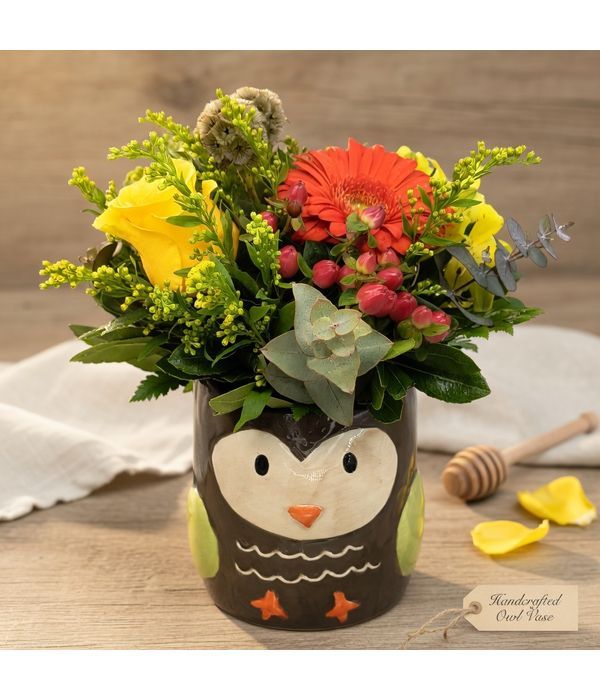 Ceramic owl with cheerful flowers