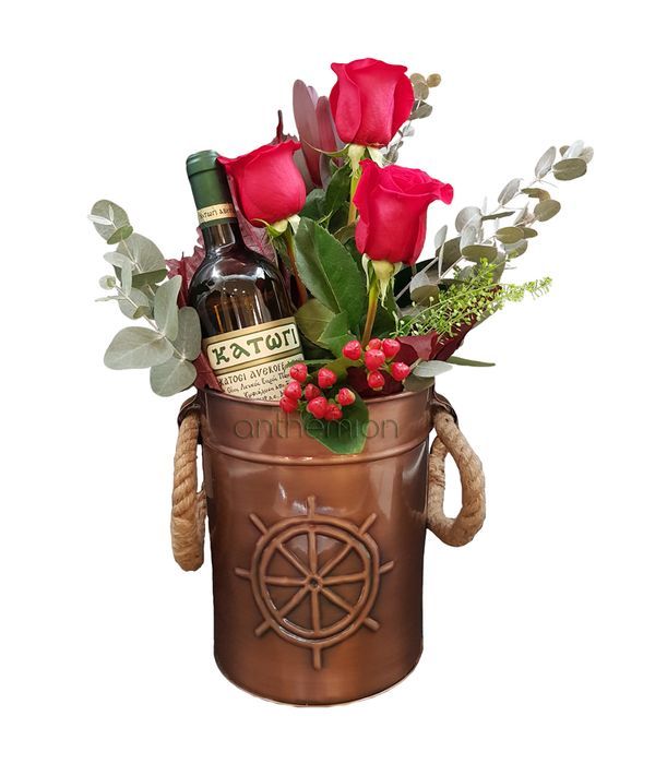 Metallic wine cooler with wine and flowers