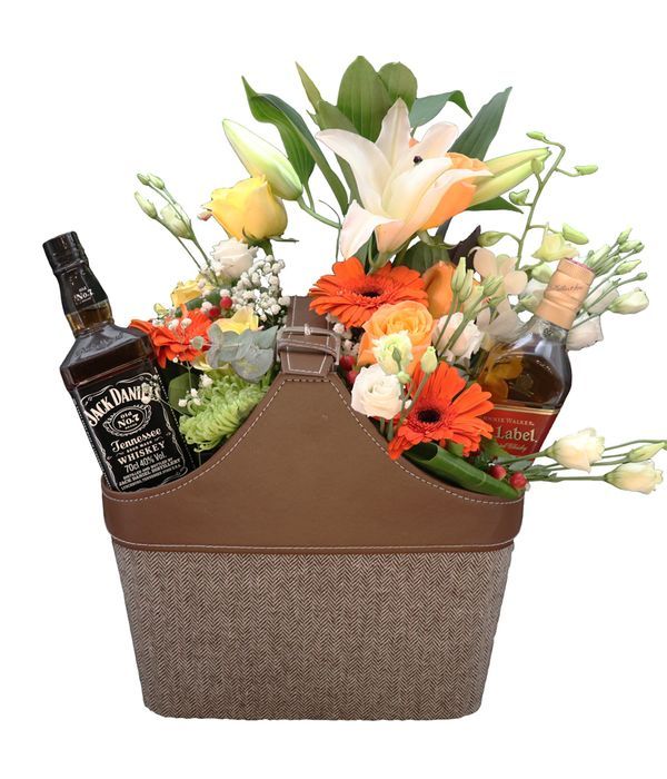 Light brown newspaper case with two whiskey and flowers 