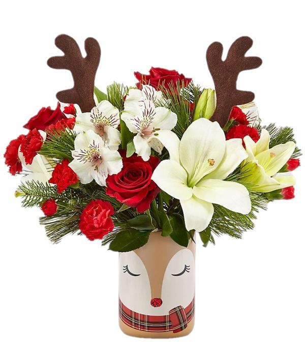 Festive bouquet in reindeer printed vase 