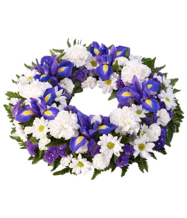 Funeral wreath with white and blue seasonal flowers