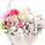Pink and white flowers in basket